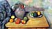 Still life, pitcher and fruit on a table by Cezanne